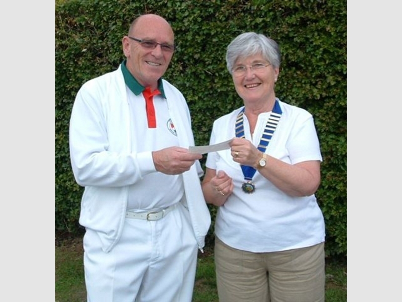 Chairman receiving Community Council Donation from Chairperson Mrs Rosa Patter